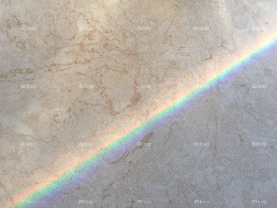 Colorful refraction on a marble surface