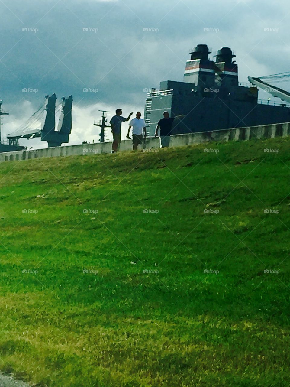 Ship workers walking on the levee