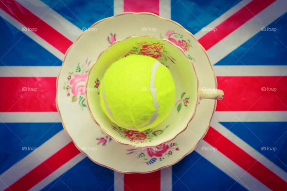 British Tennis. A tennis ball inside a cup on a Union Jack flag