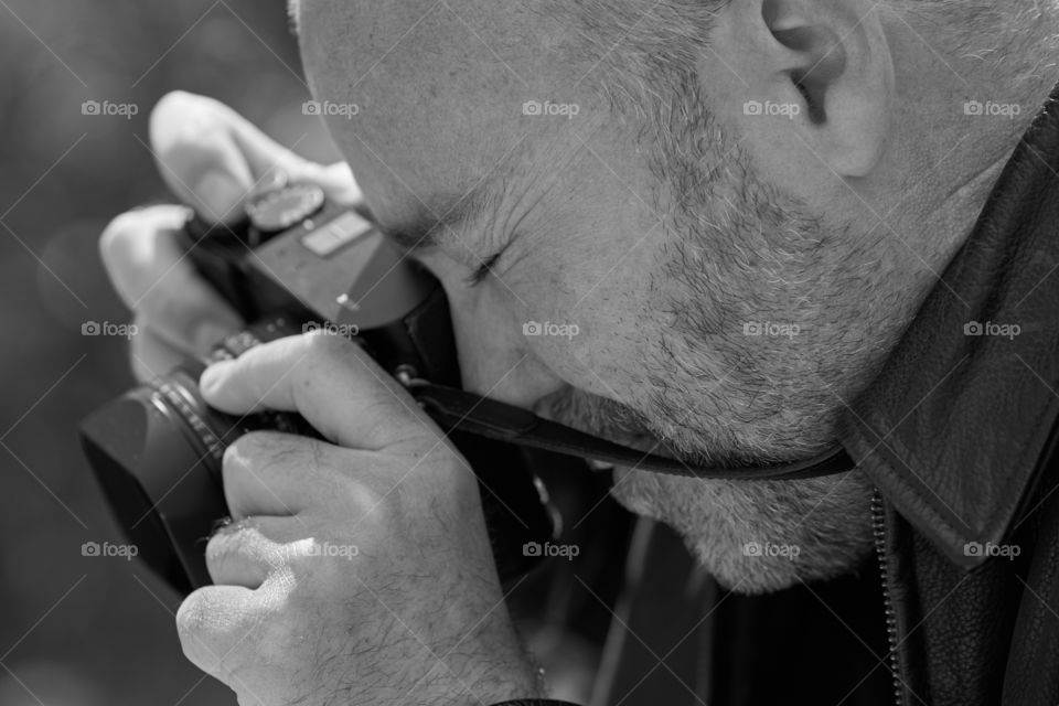 Close up of man taking photograph