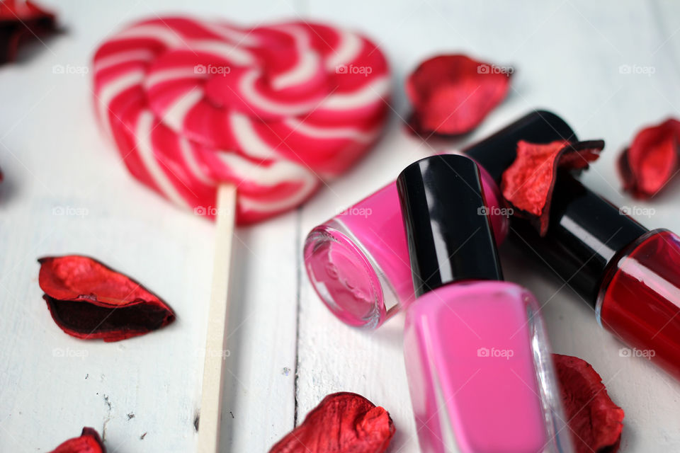 Beauty, health, spa and personal care: nail polish, flowers, rose petals, sweet