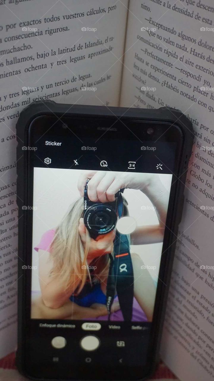 Cell-phone#book#camera#human