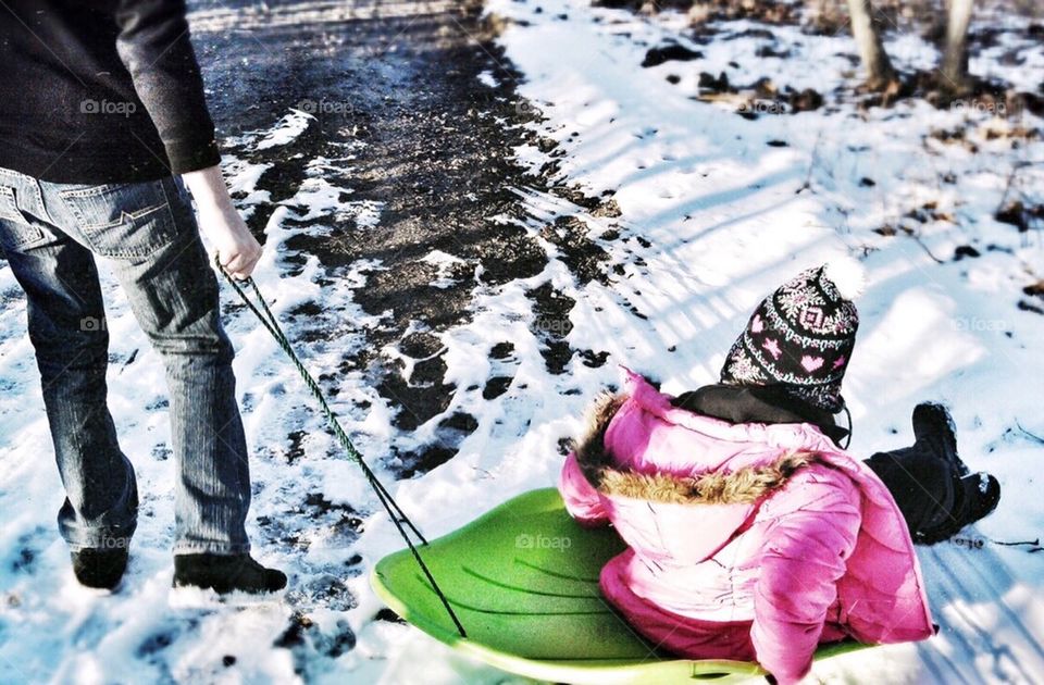 Children Sledding in the Snow