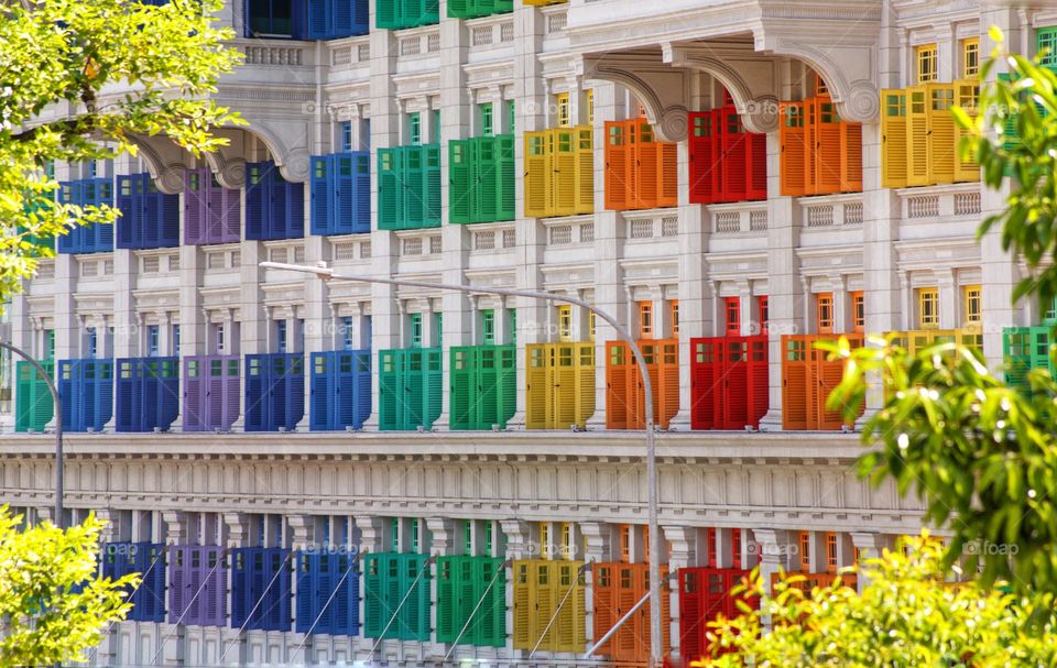 Rainbow coloured windows at the old police station in Singapore.