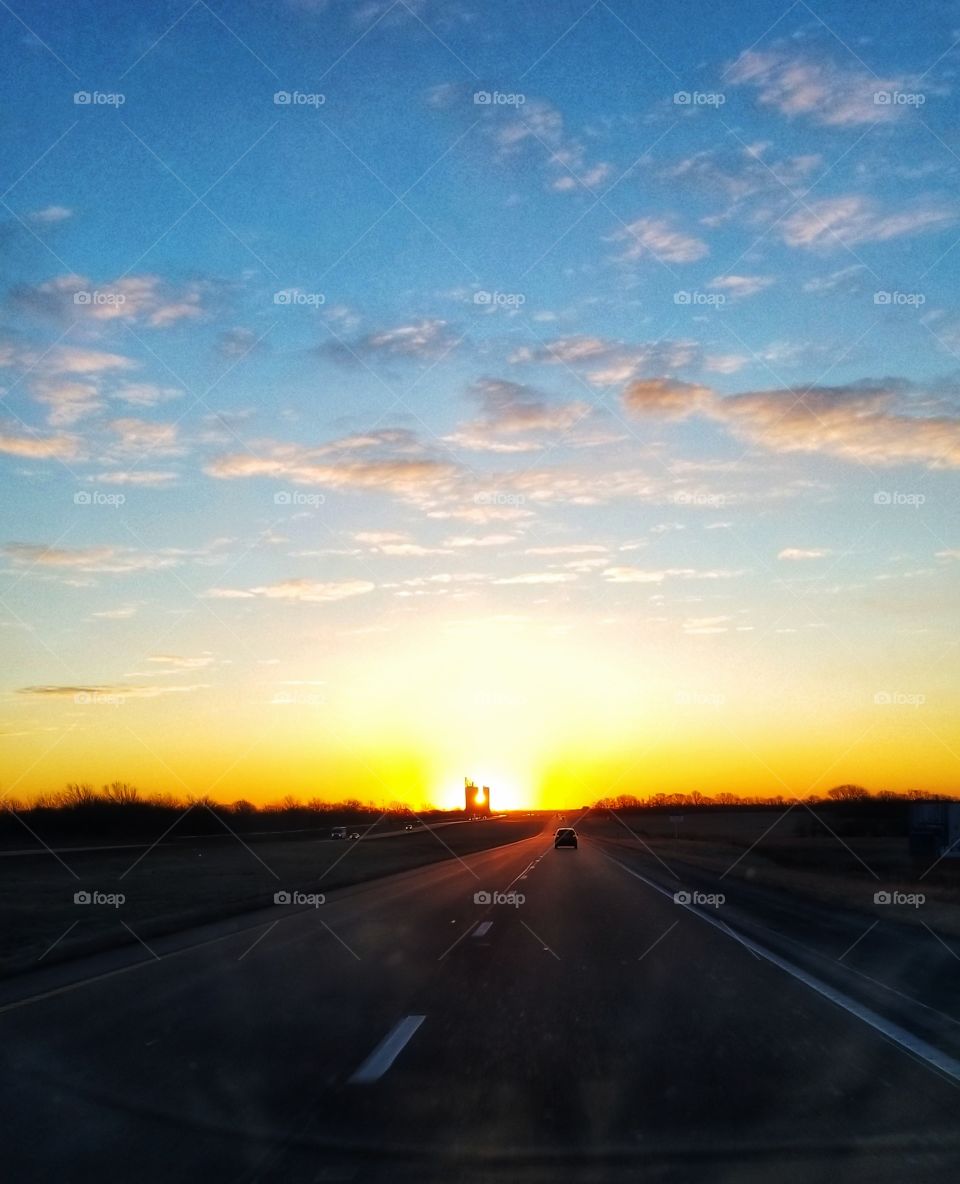 Sunrise Between the Grain Elevator