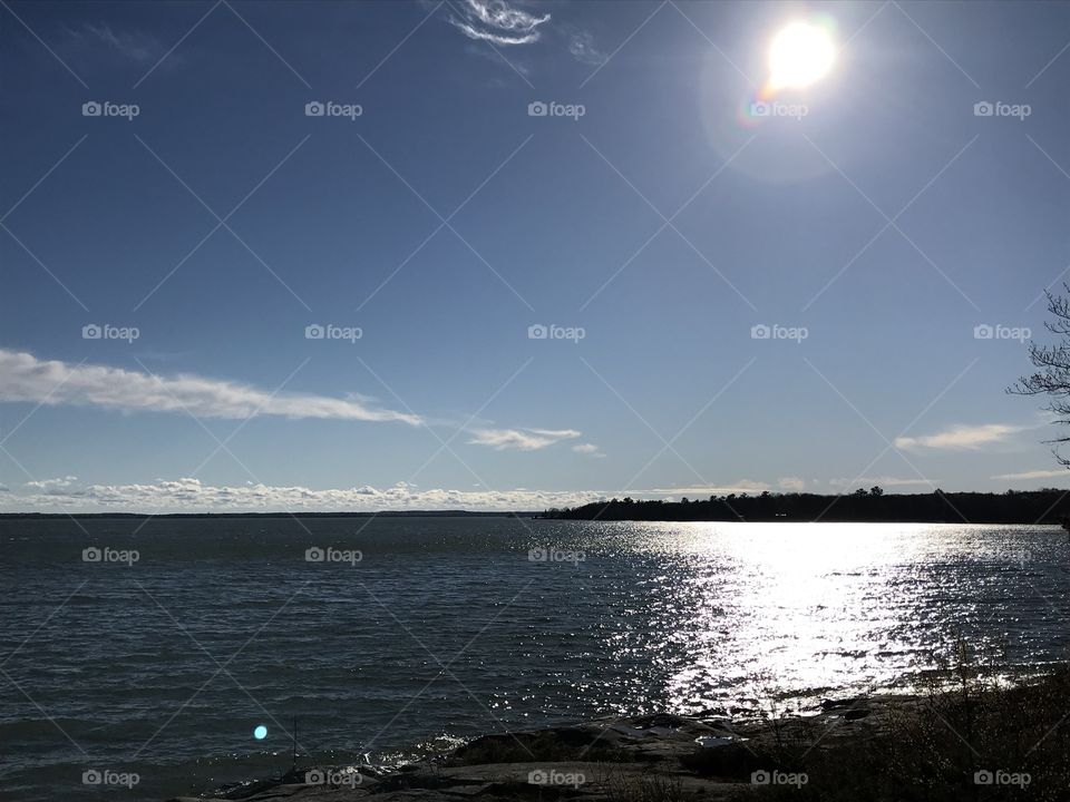 Sun shining over water