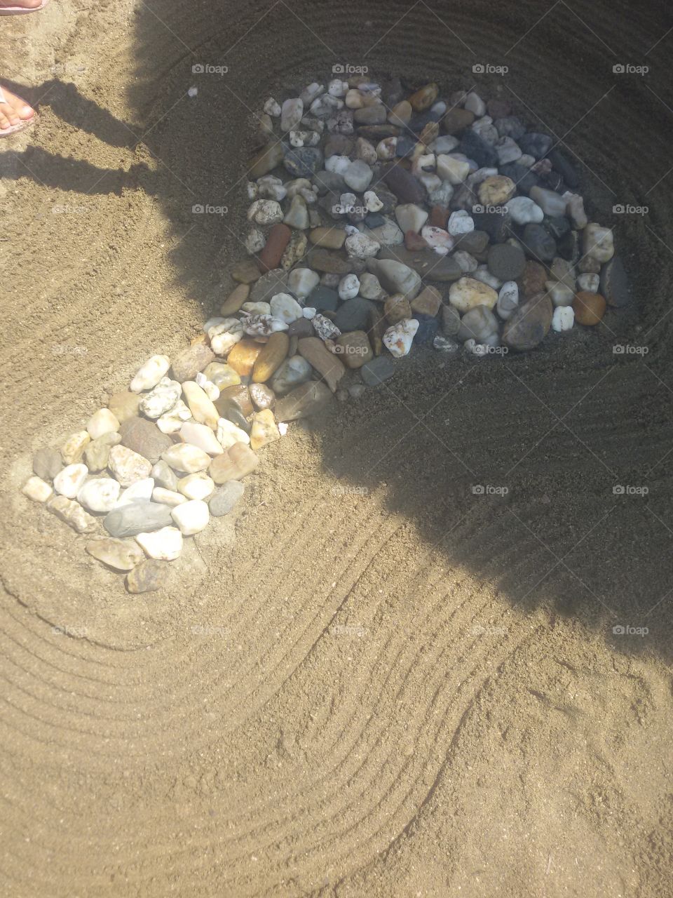 Tree made of rocks on beach