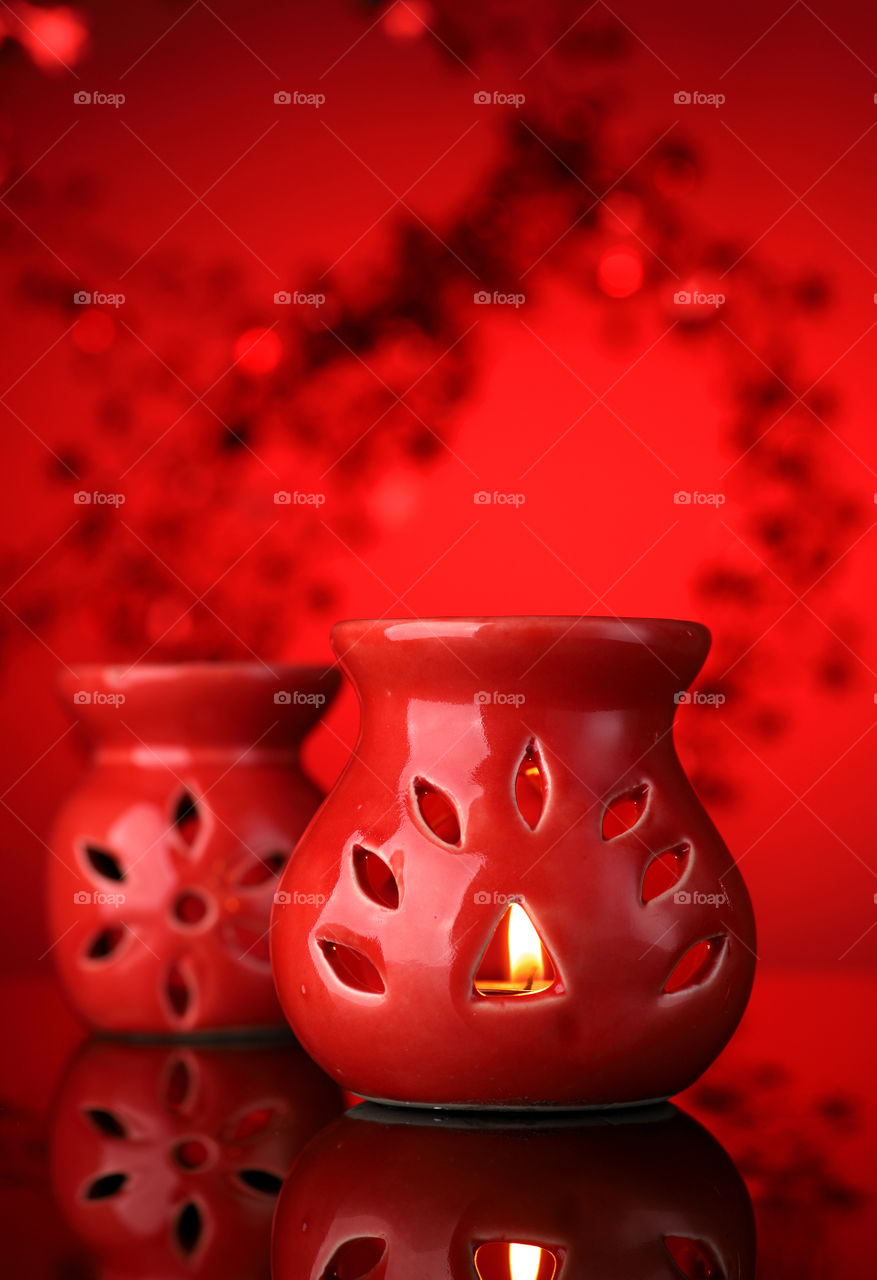 Red aroma diffuser in red background