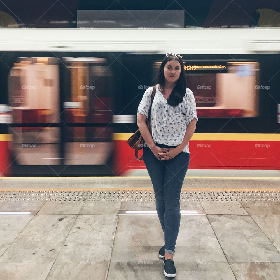 Portrait of woman standing on platform