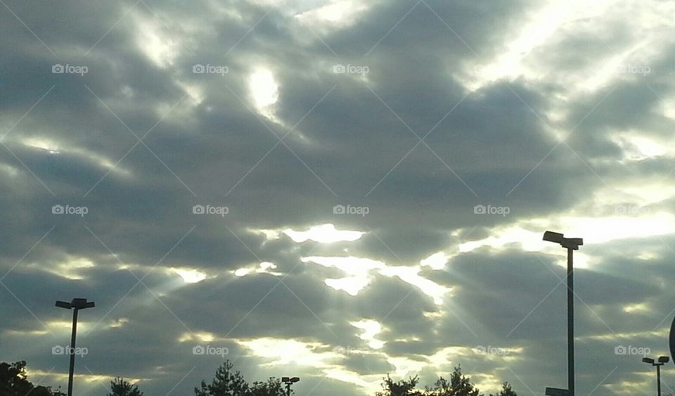 Picture of the sky taken on a cloudy day where the sun was peaking out just right