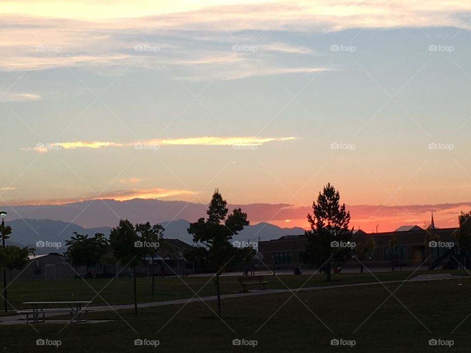 A sunset at our favorite park. Layered mountains separated by color and pastel skies. 
