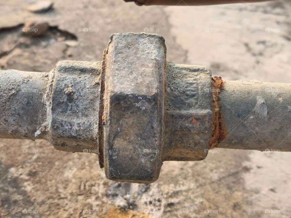 closeup of a joint made up of iron bolt