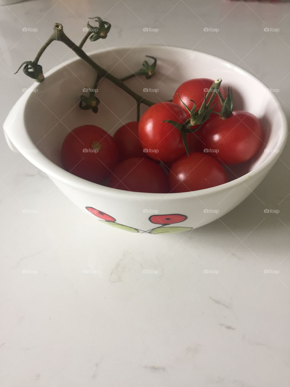 A bowl of small tomatoes