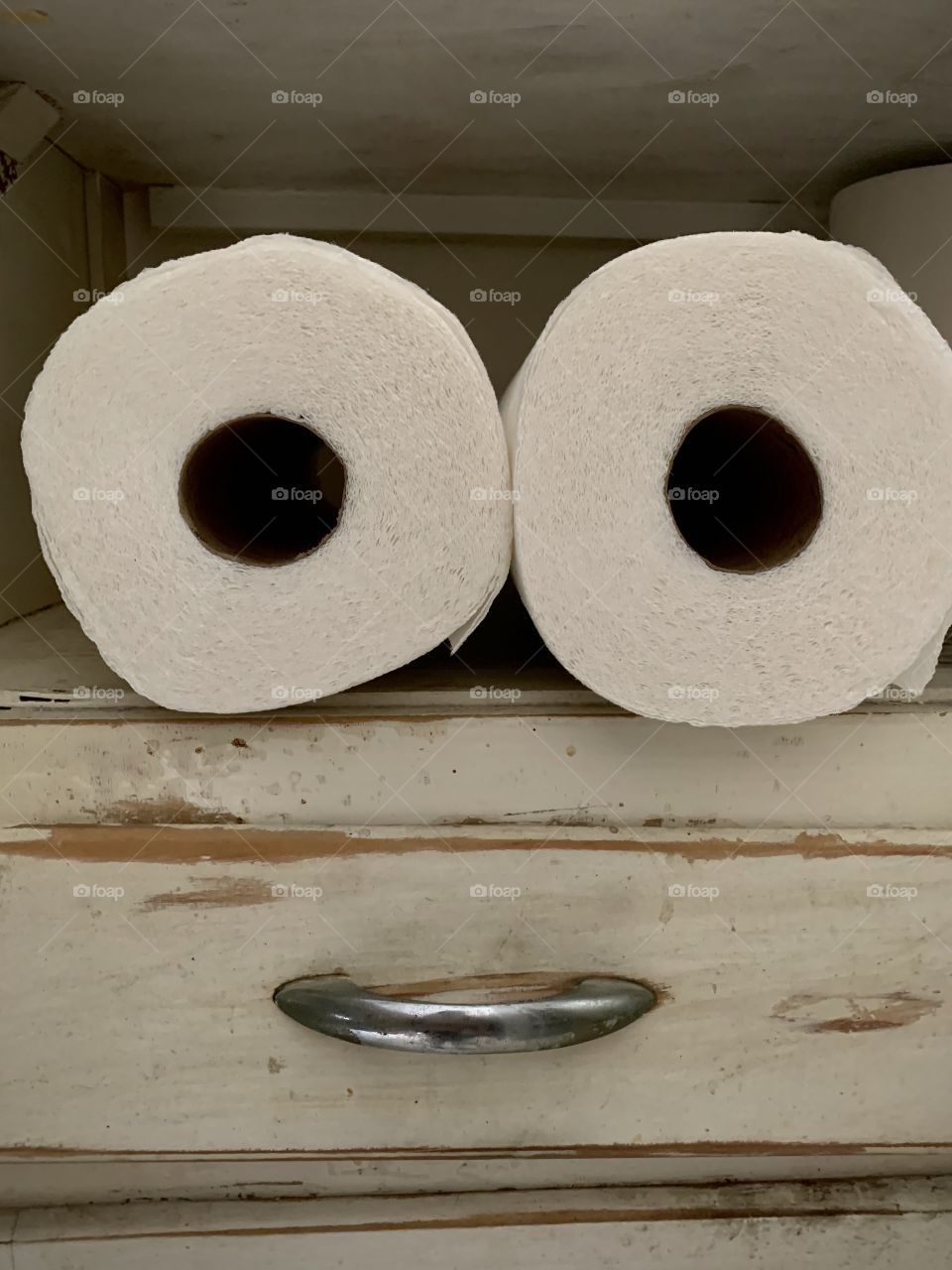 Paper towel rolls on a shelf
