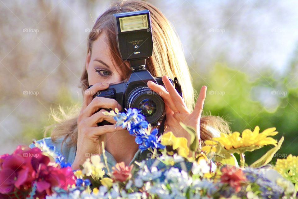 Photographing a bright mix of colorful flowers.