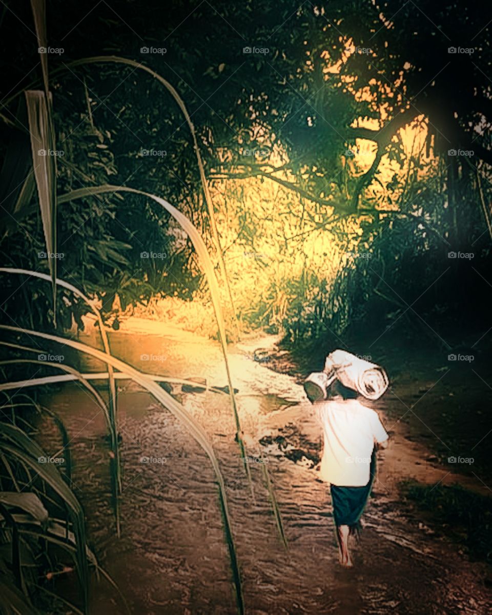 A man waking alone in stream to find his new life