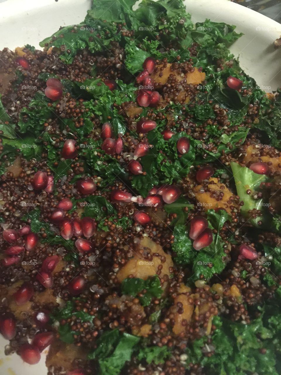 Red quinoa, sweet potatoes, kale and pomegranate dinner 