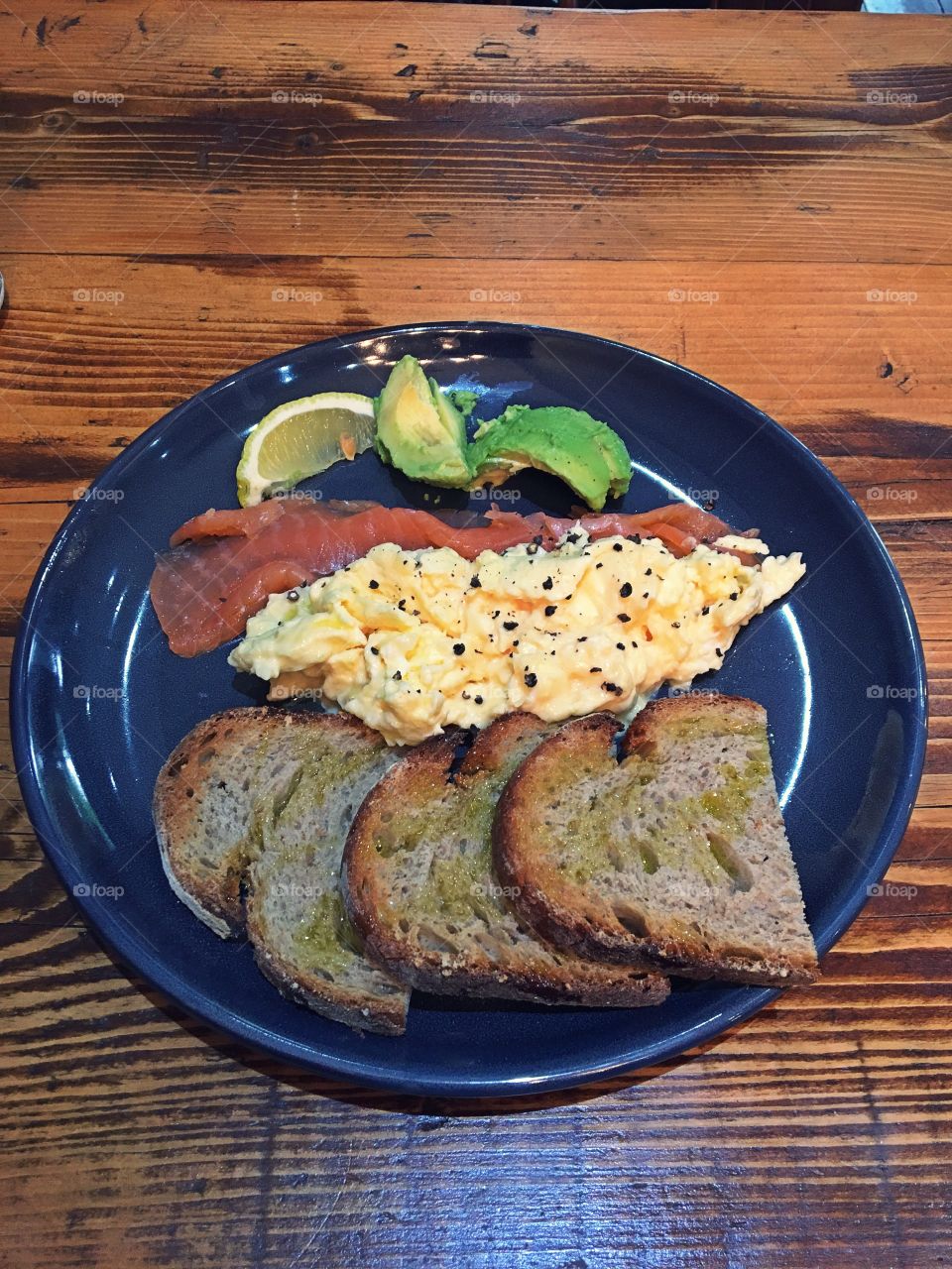 Scrambled eggs and salmon on toast 