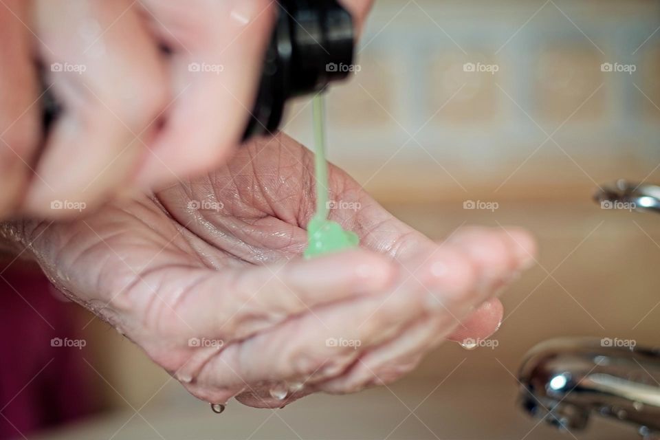 Shaving cream being sprayed on a hand