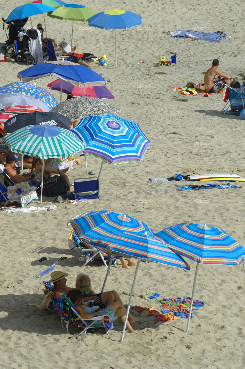 People enjoying a day at the beach in Laguna Beach California.