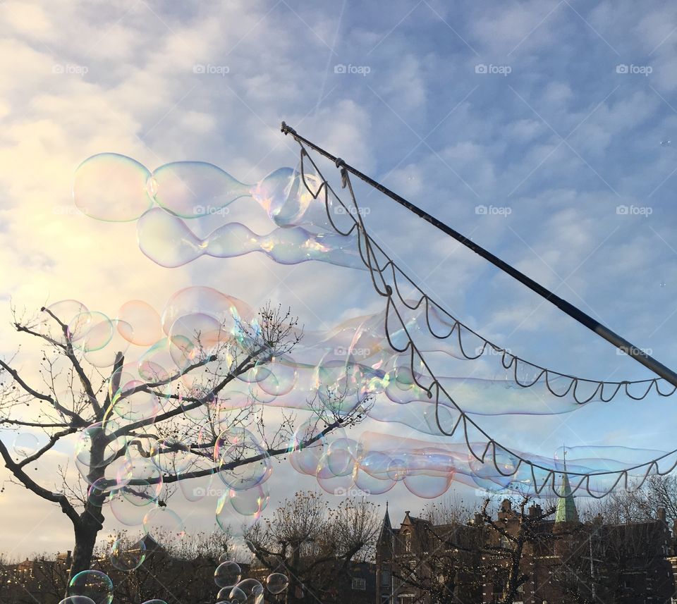 Soap balloons at a sky background 
