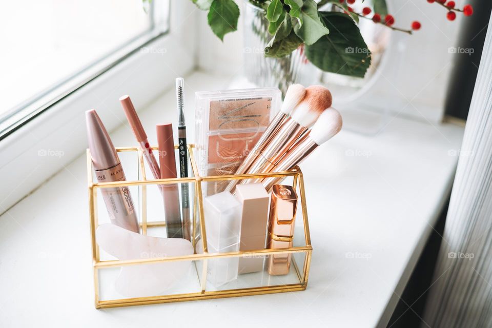 Makeup products on window sill