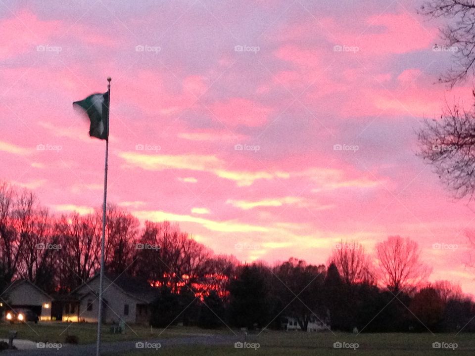 Great pink sky in the sunset as our flag waves in the wind