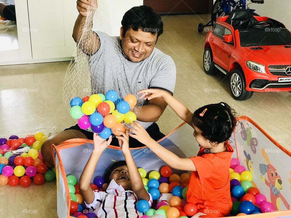 Father had a great fun time with kids by playing with kids in ball pit at home 🏡