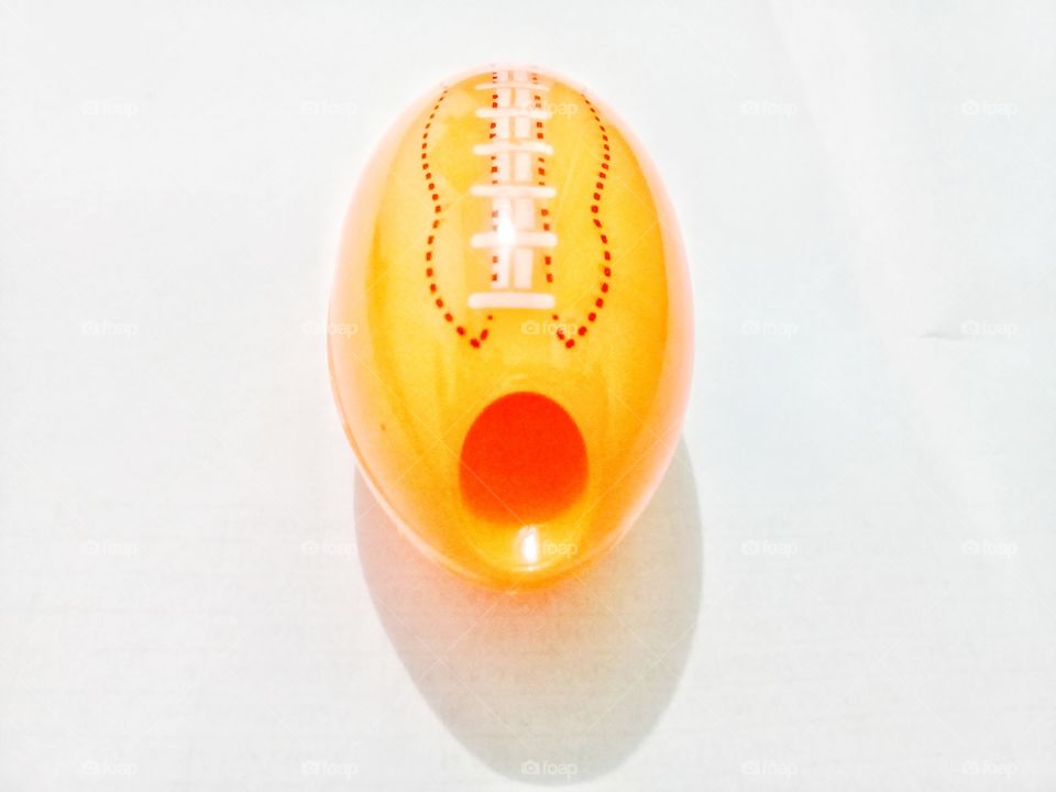 pencil sharpener.this pencil sharpener has a simple,unique model with an orange ruby ball shaped plastic
