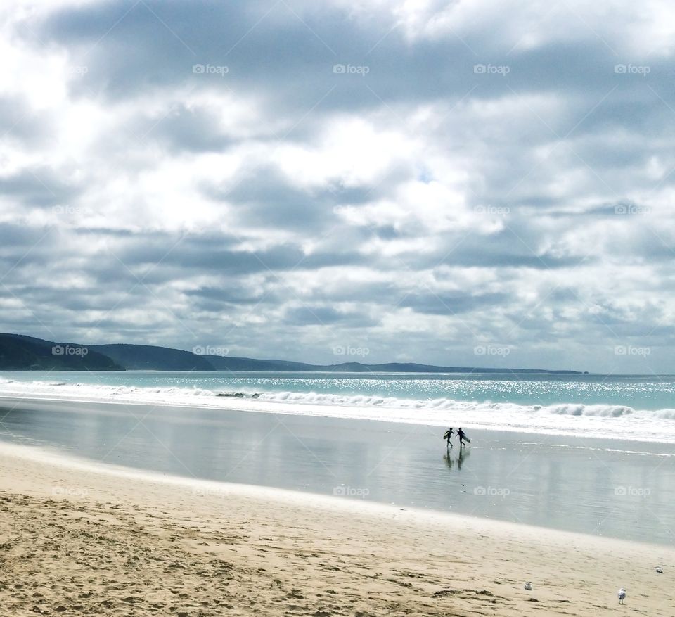 surfers on the beach, Australia.