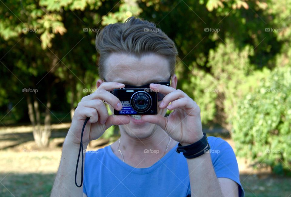 A man is taking a pictures