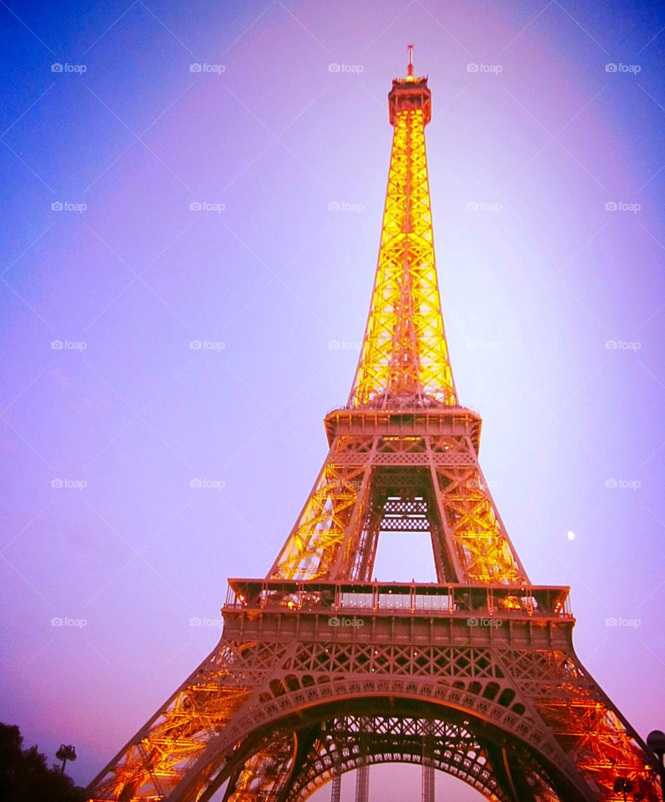 Purple sky and the Eiffel Tower in Paris at dusk.
