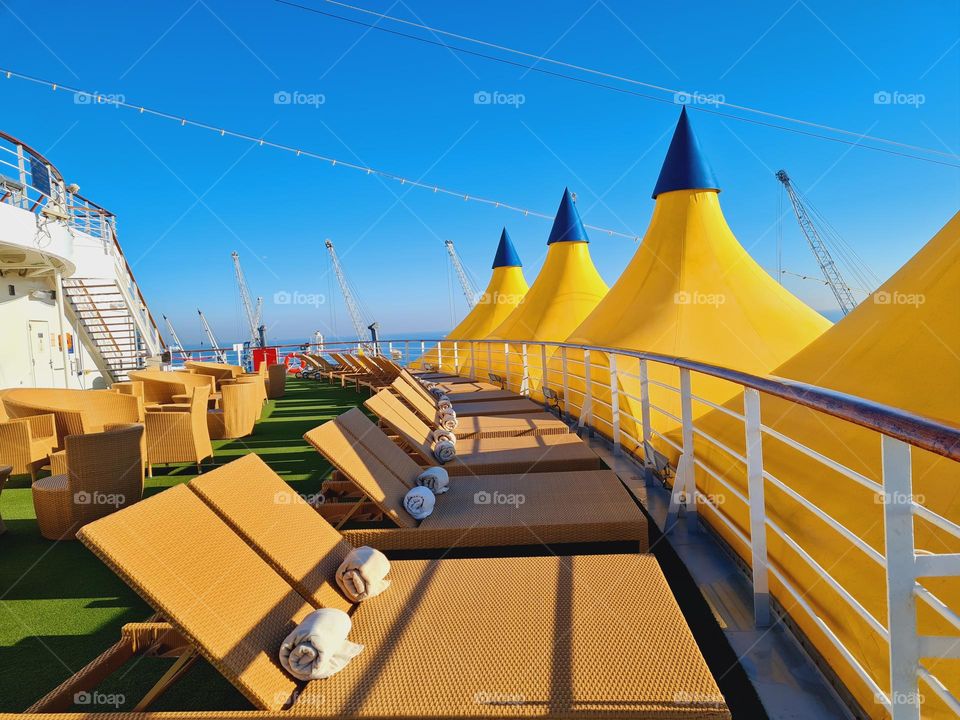 triangular tarps used as sun covers on the cruise ship