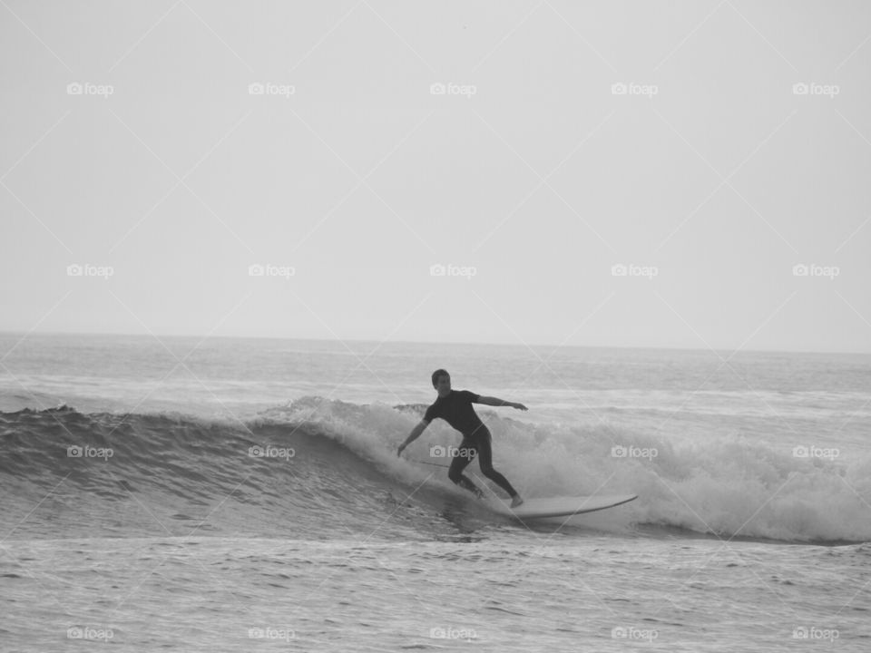 Riding the waves at Wrightsville Beach.