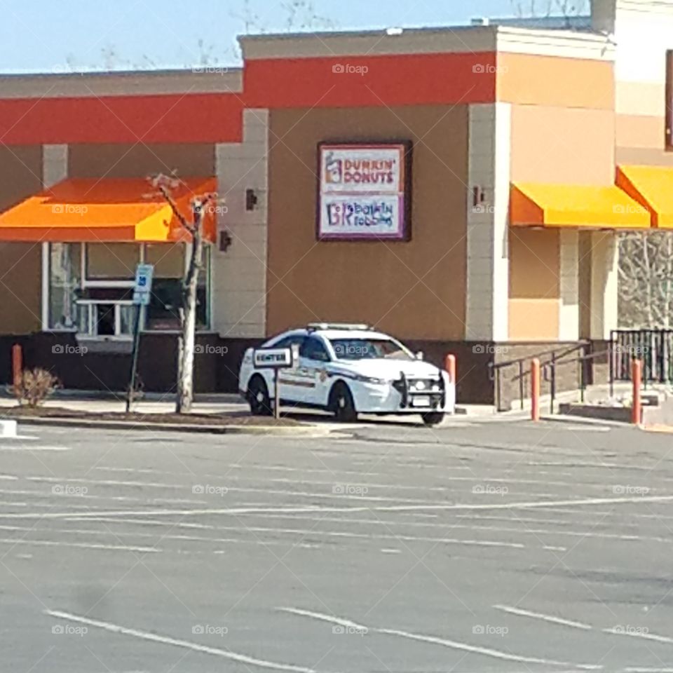 cop at donut shop,  irony