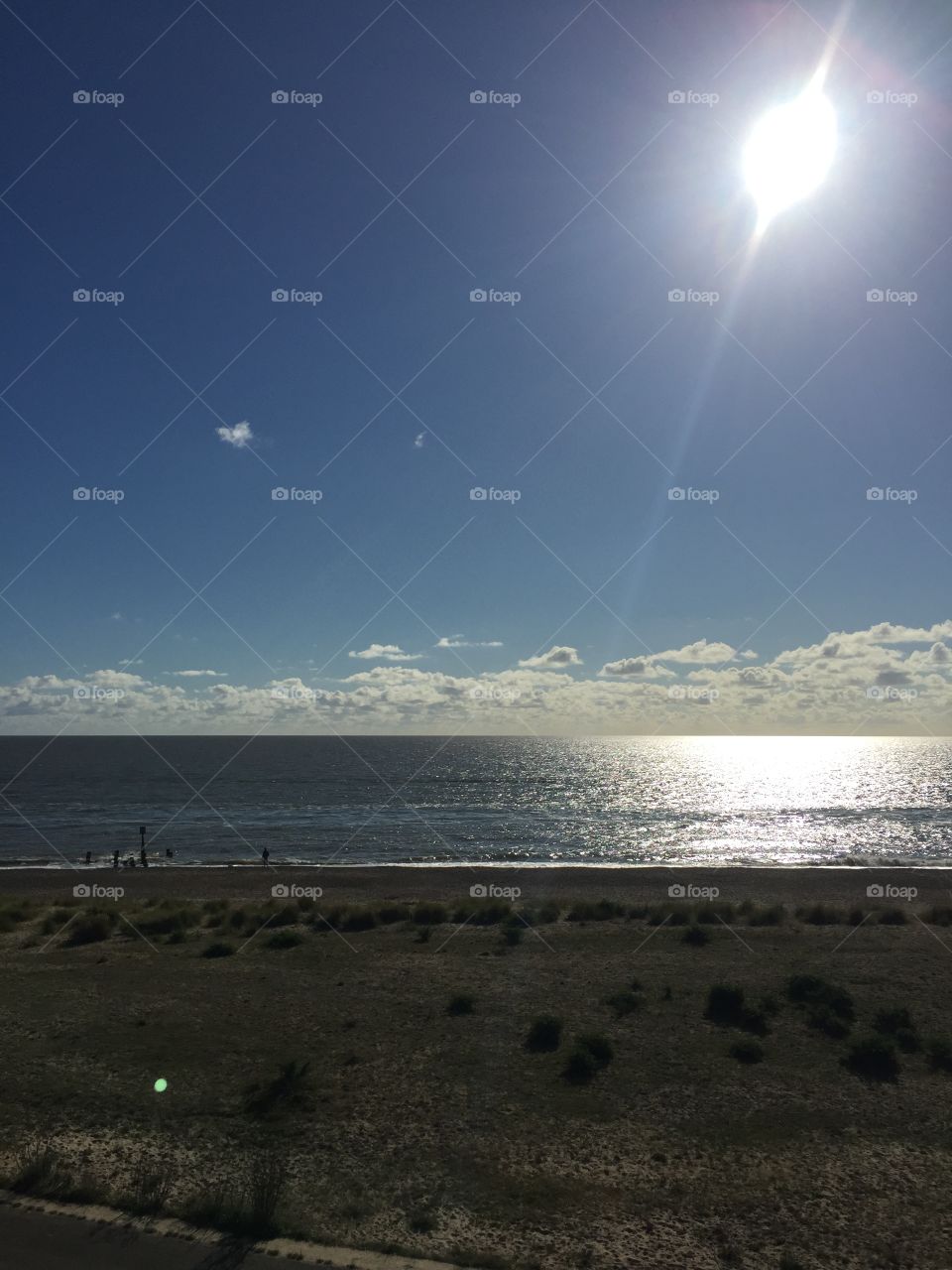 Beach with sunrising on water