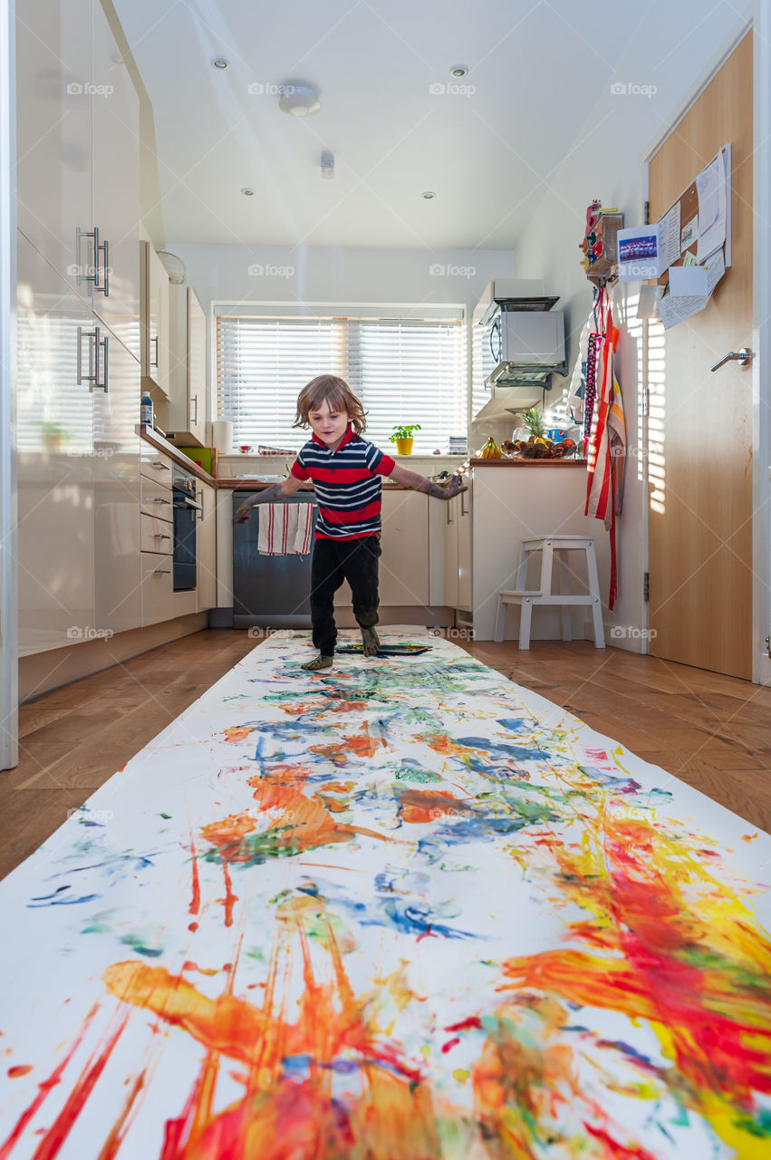 Little crazy artist and his painting.