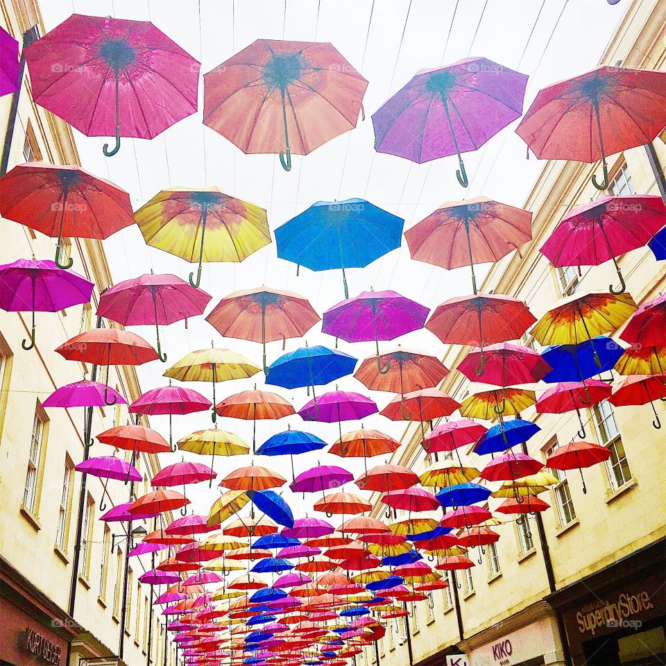 Colorful umbrella display in the streets of Bath during a festival 