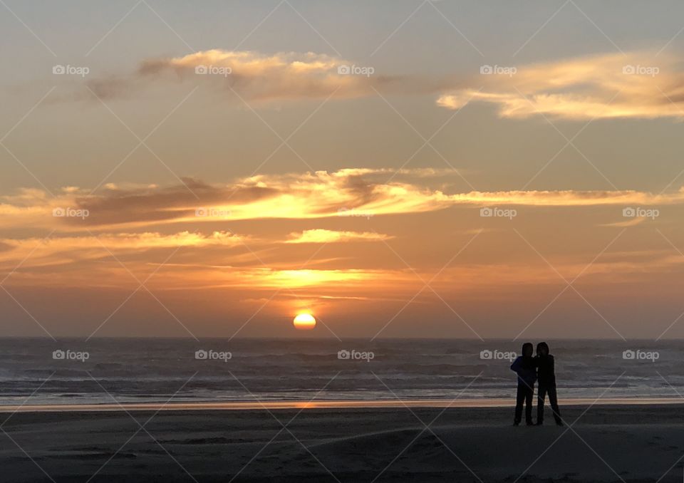 Kids enjoying a summer sunset 