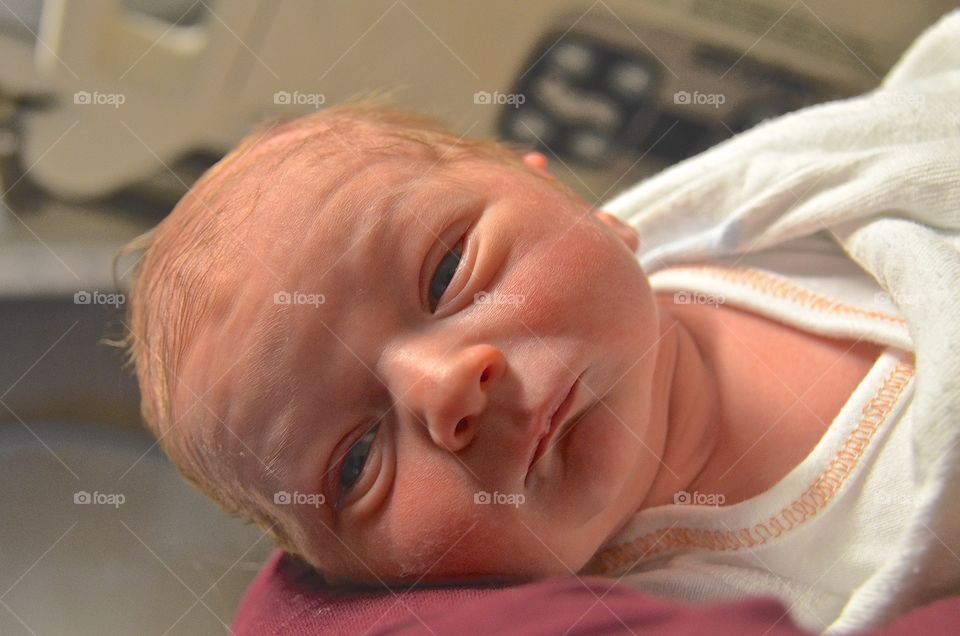 Portrait of tiny newborn baby