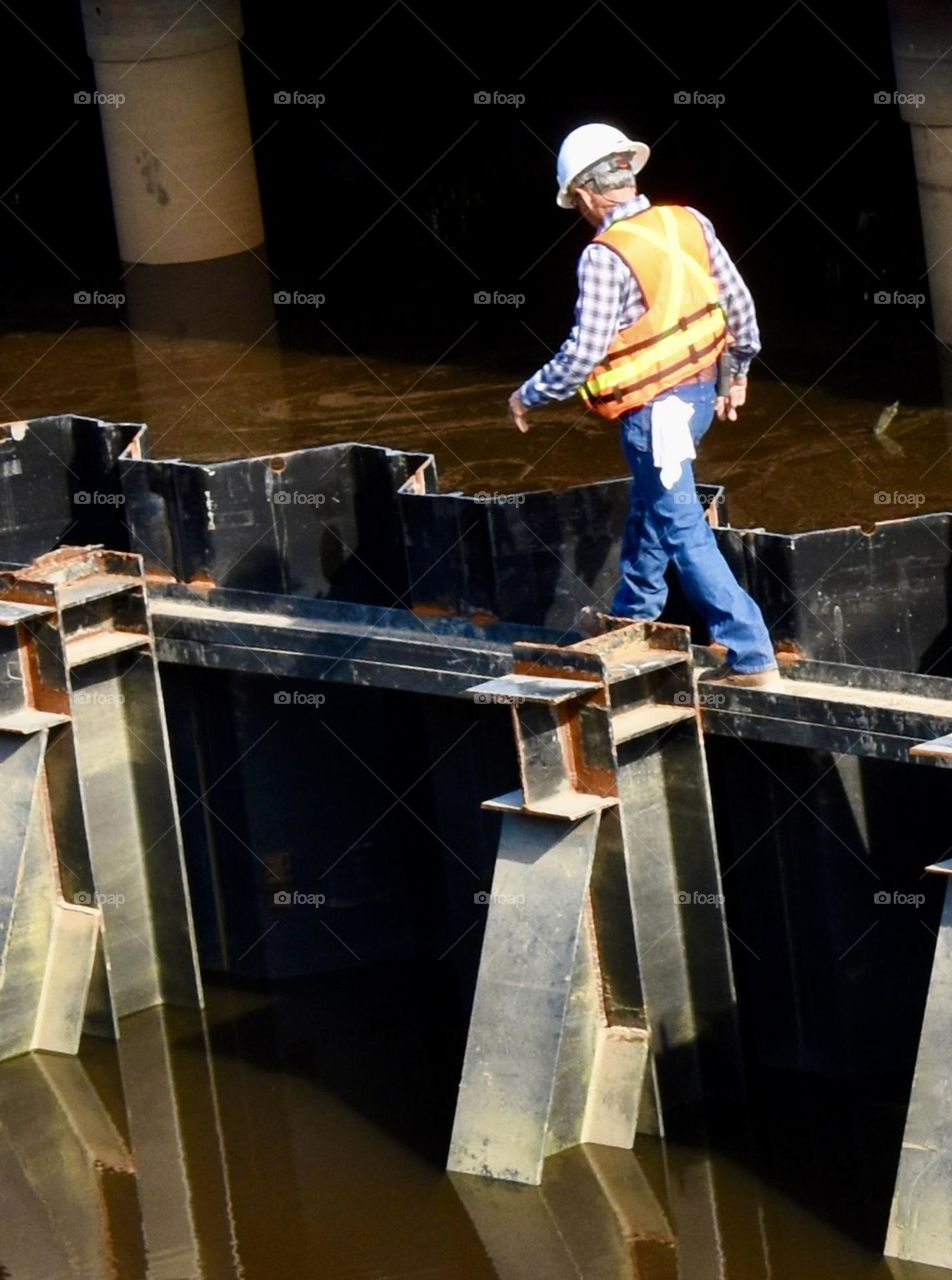 Man walking in a beam at work