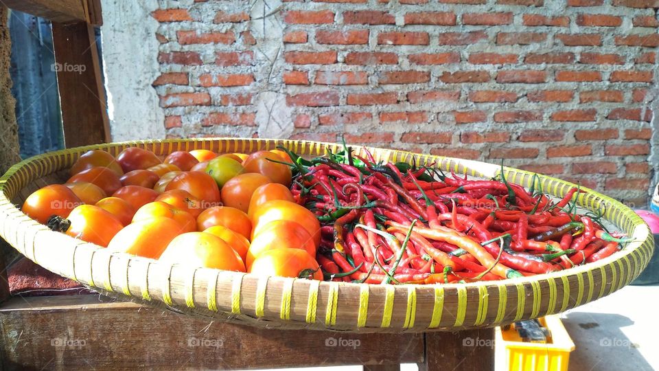 Tomato red chili and green chili in one container