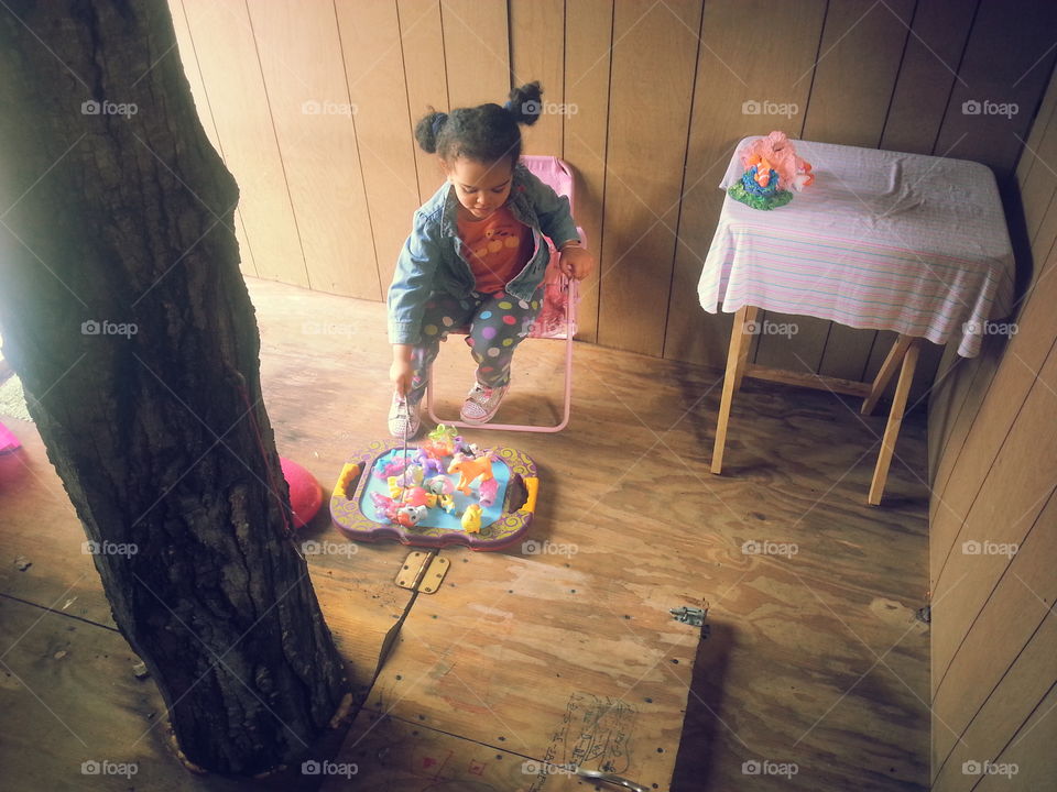 Small child playing with toy