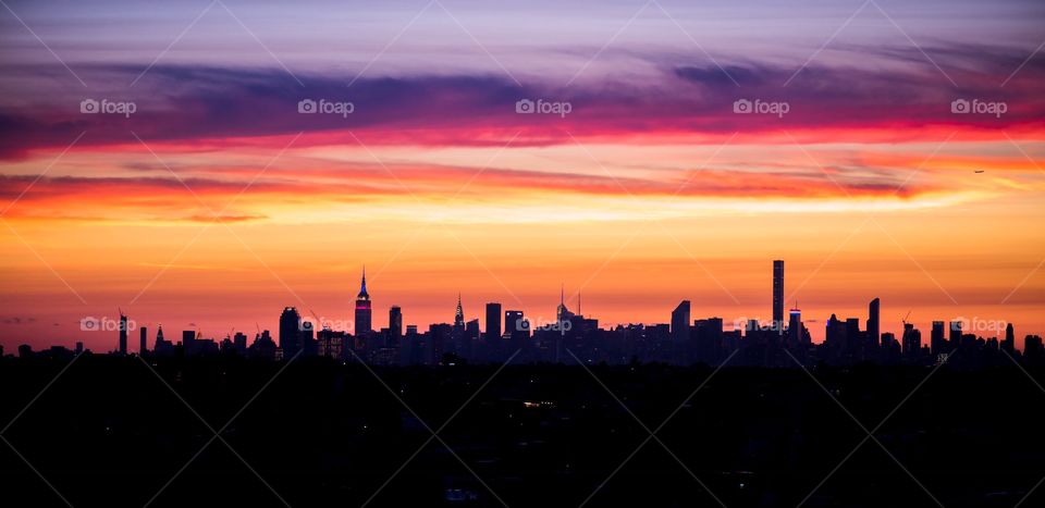 Silhouette of city and dramatic sky