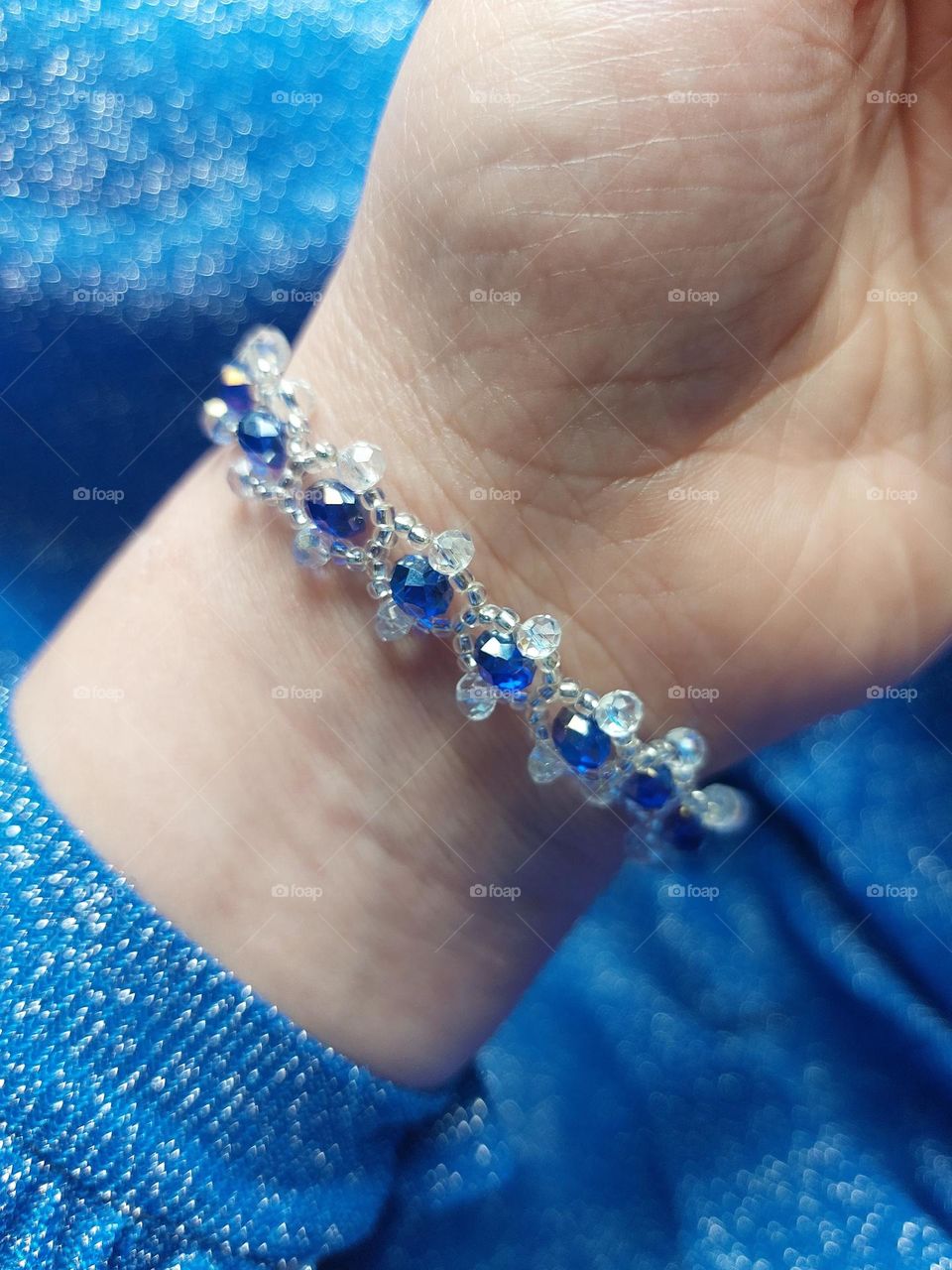 handmade bracelet with sparkly blue stones.