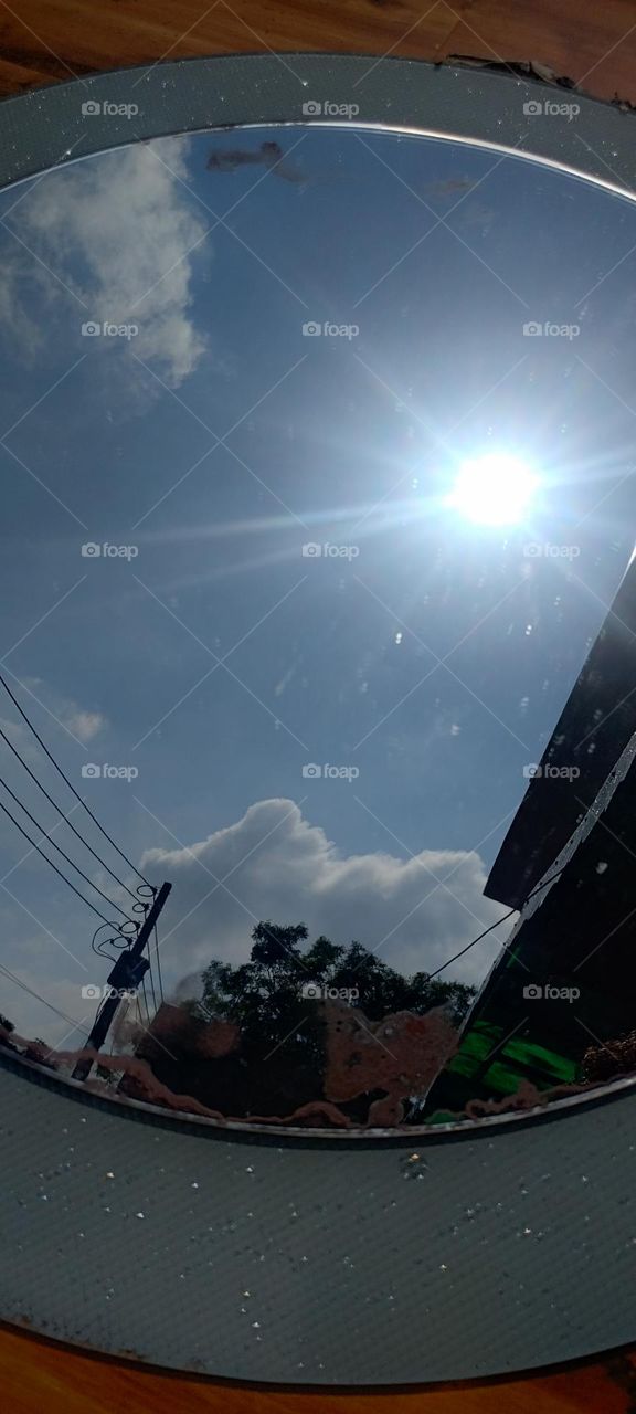 Mirror play sun and clouds