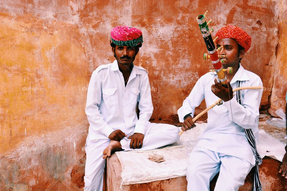 The local musicians . Took this picture at the amber fort jaipur rajasthan . Two local musicians were sitting playing good music for money