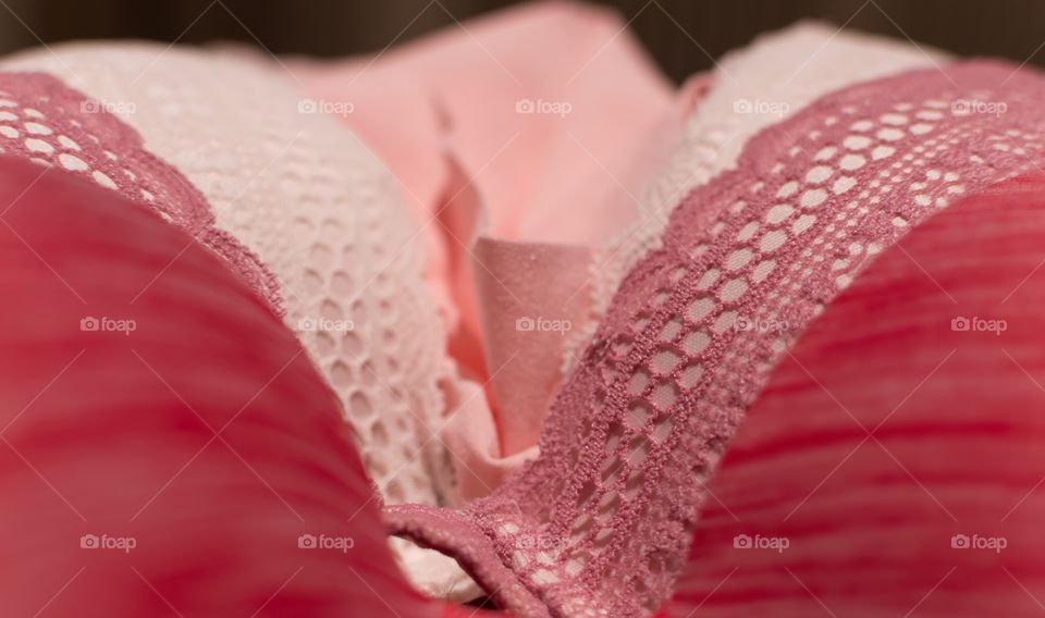 Shades of pink in the details inside the drawers in the bedroom - pink undergarments in different textures 