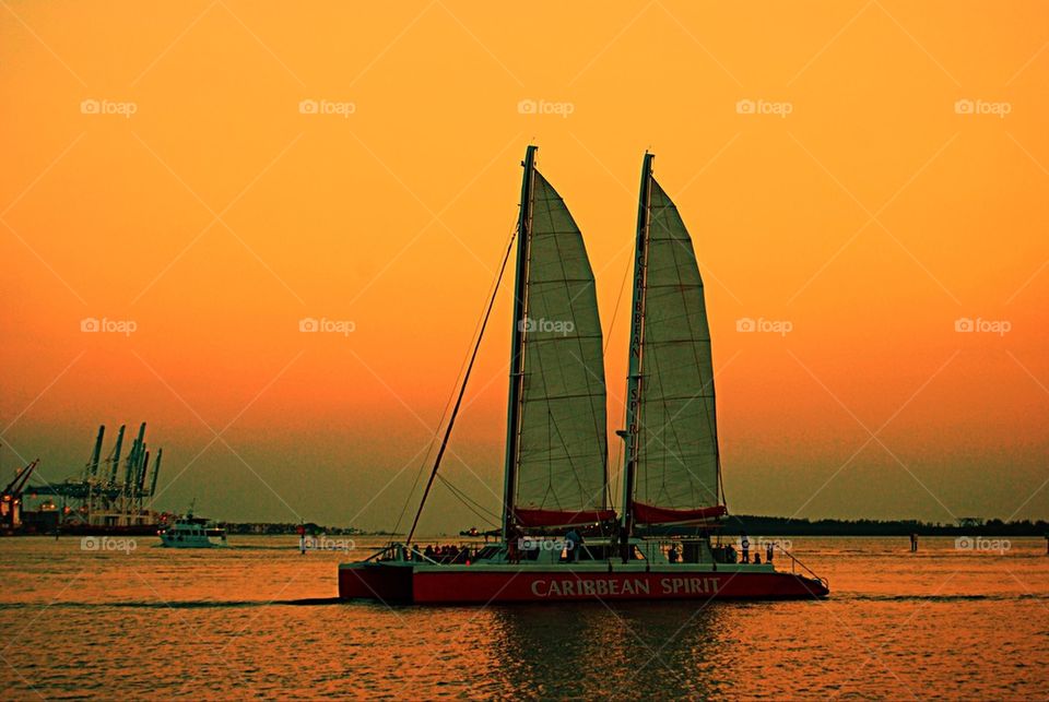 Sail boat on the sunset