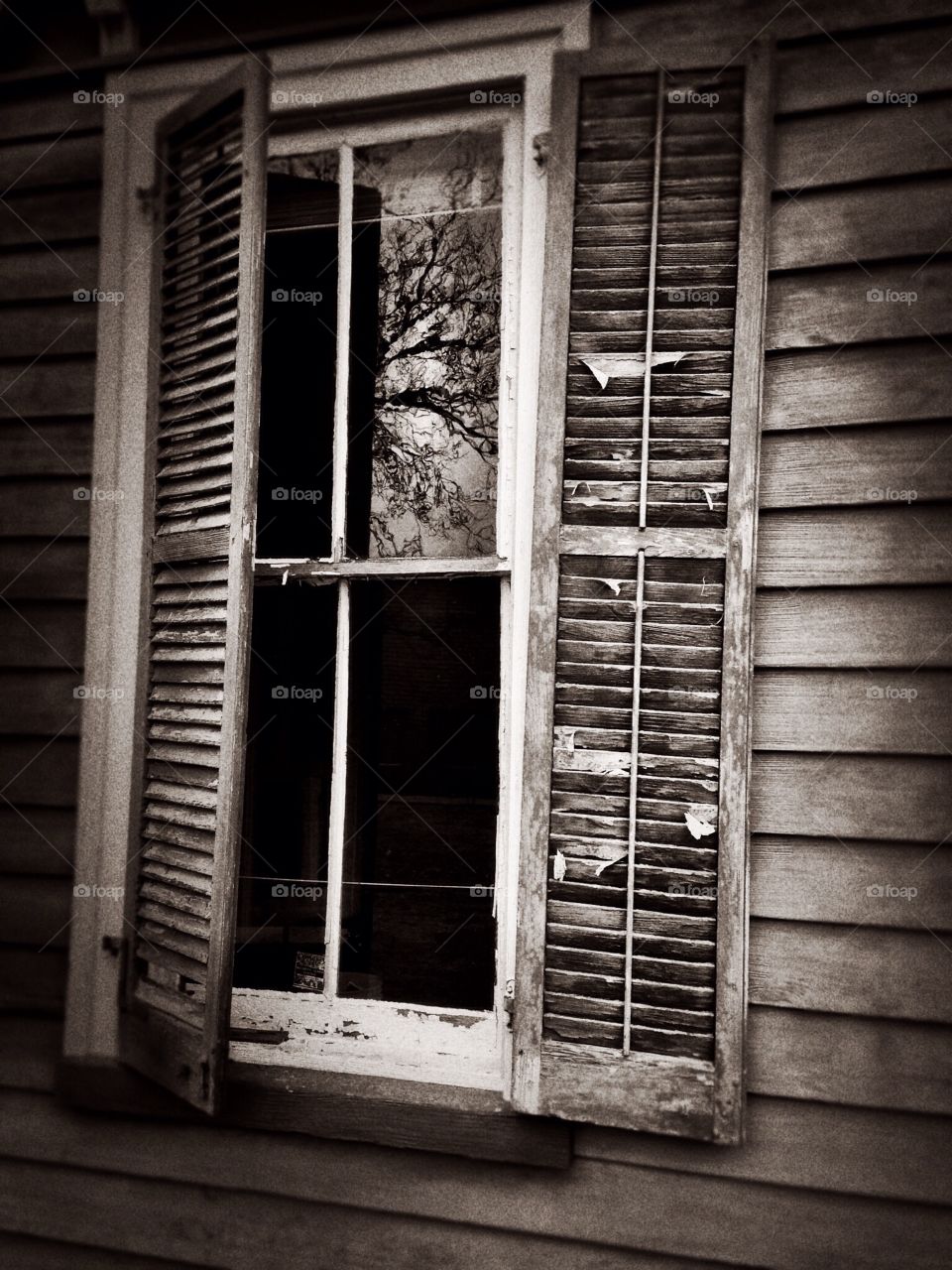 Mansard window. Window and shutters from historic home.